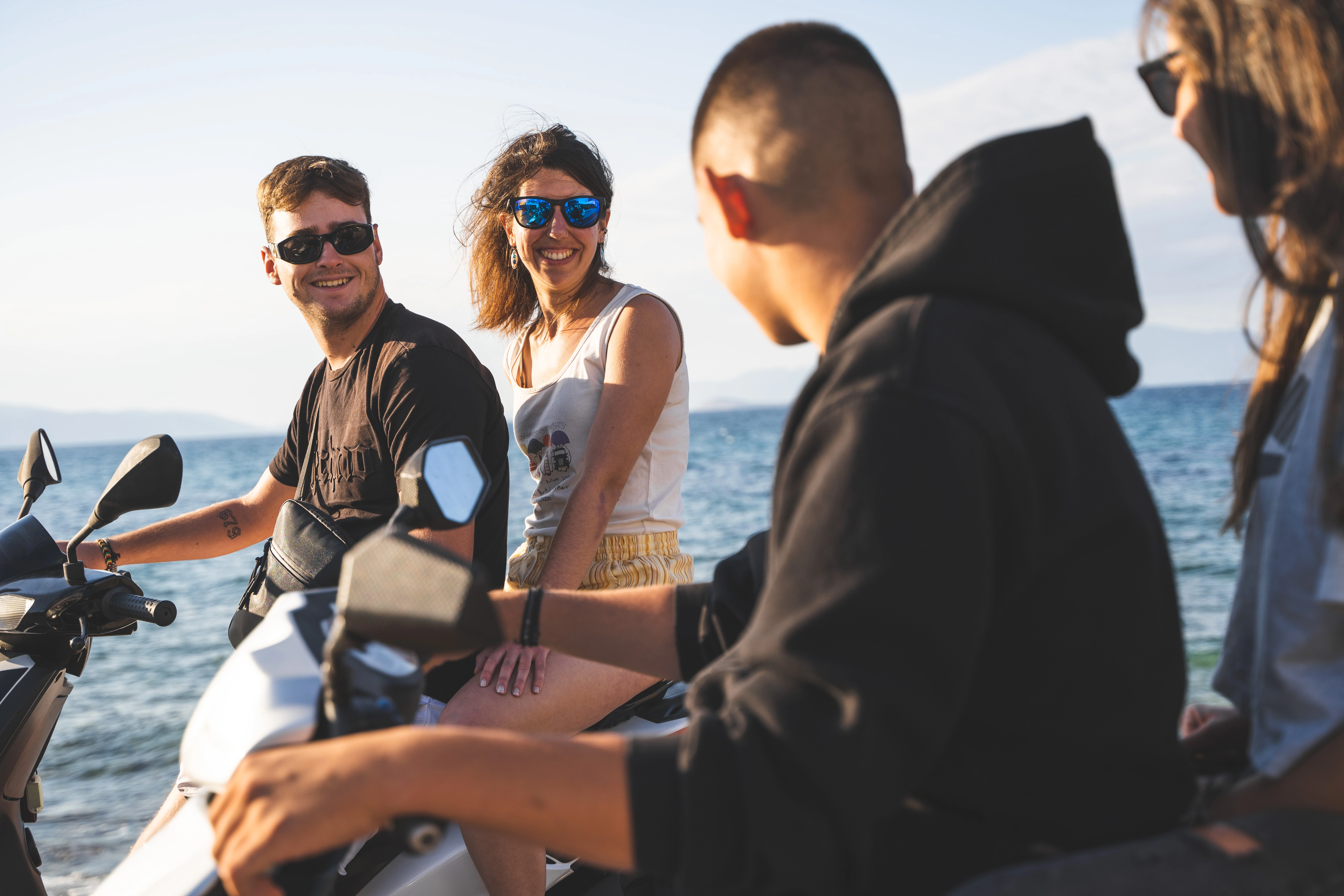 happy customers chatting on our rental scooters
