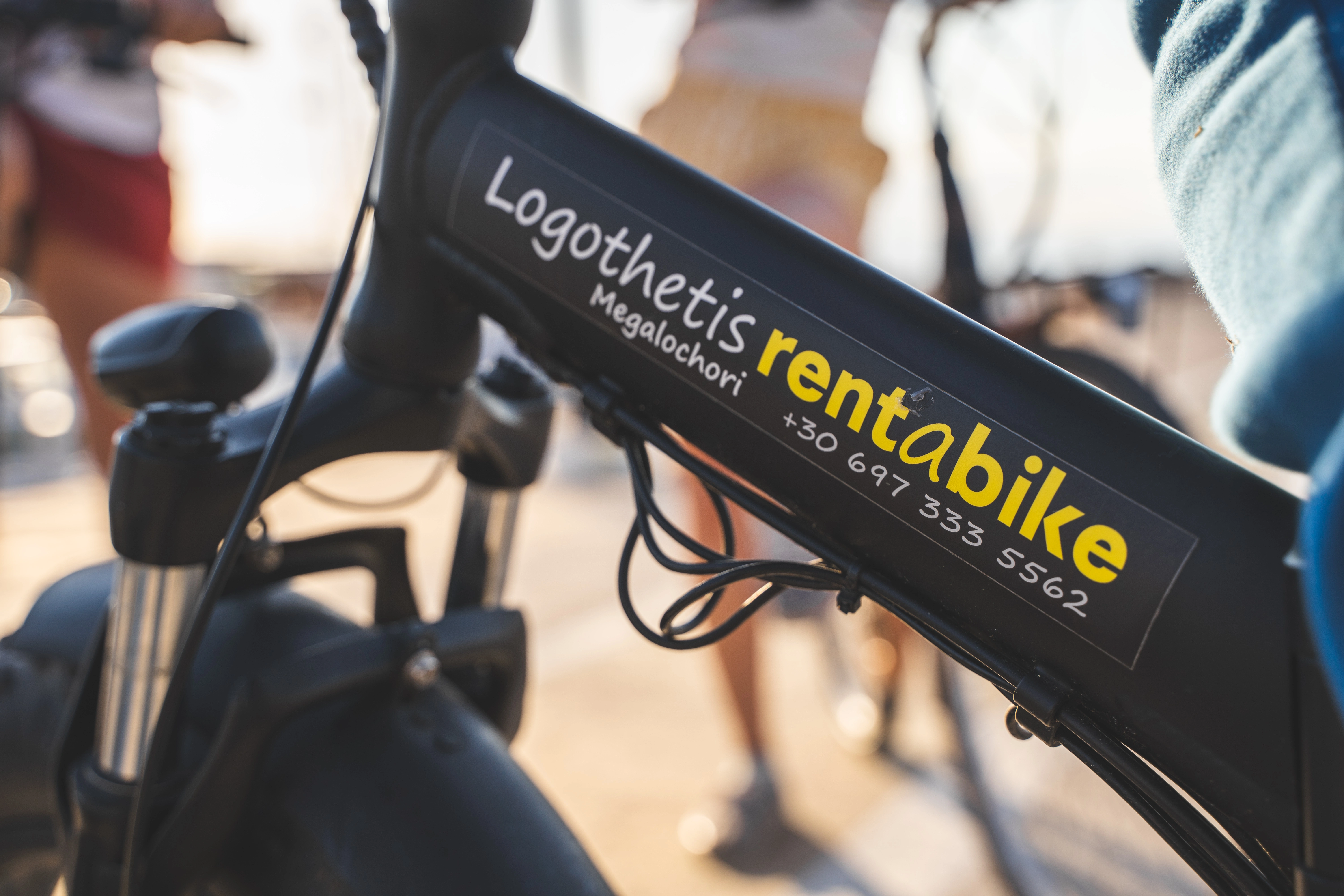 Logothetis rent a bike badge on a rental bike