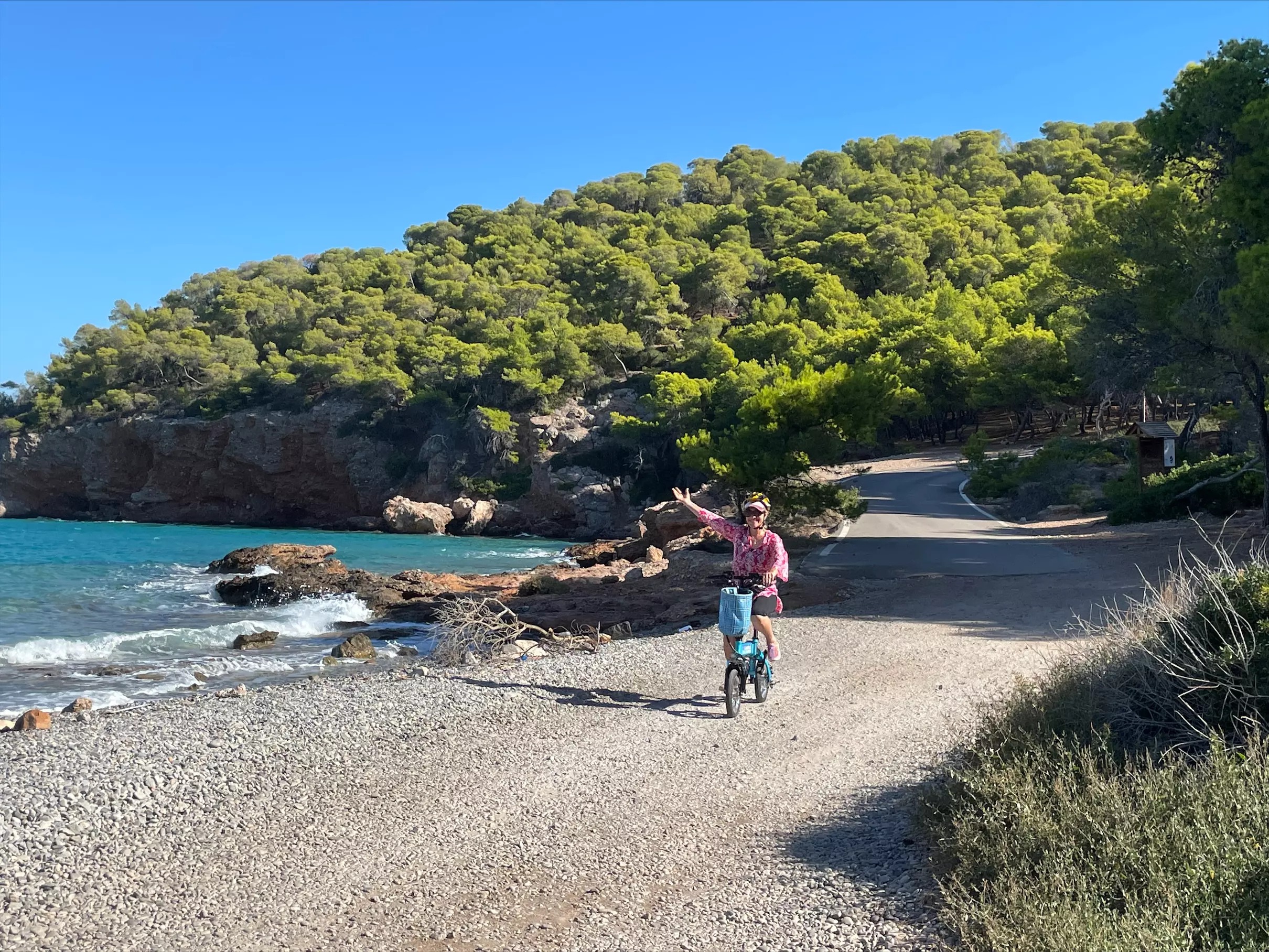 A happy customer riding our e-bike at Dragonera Beach
